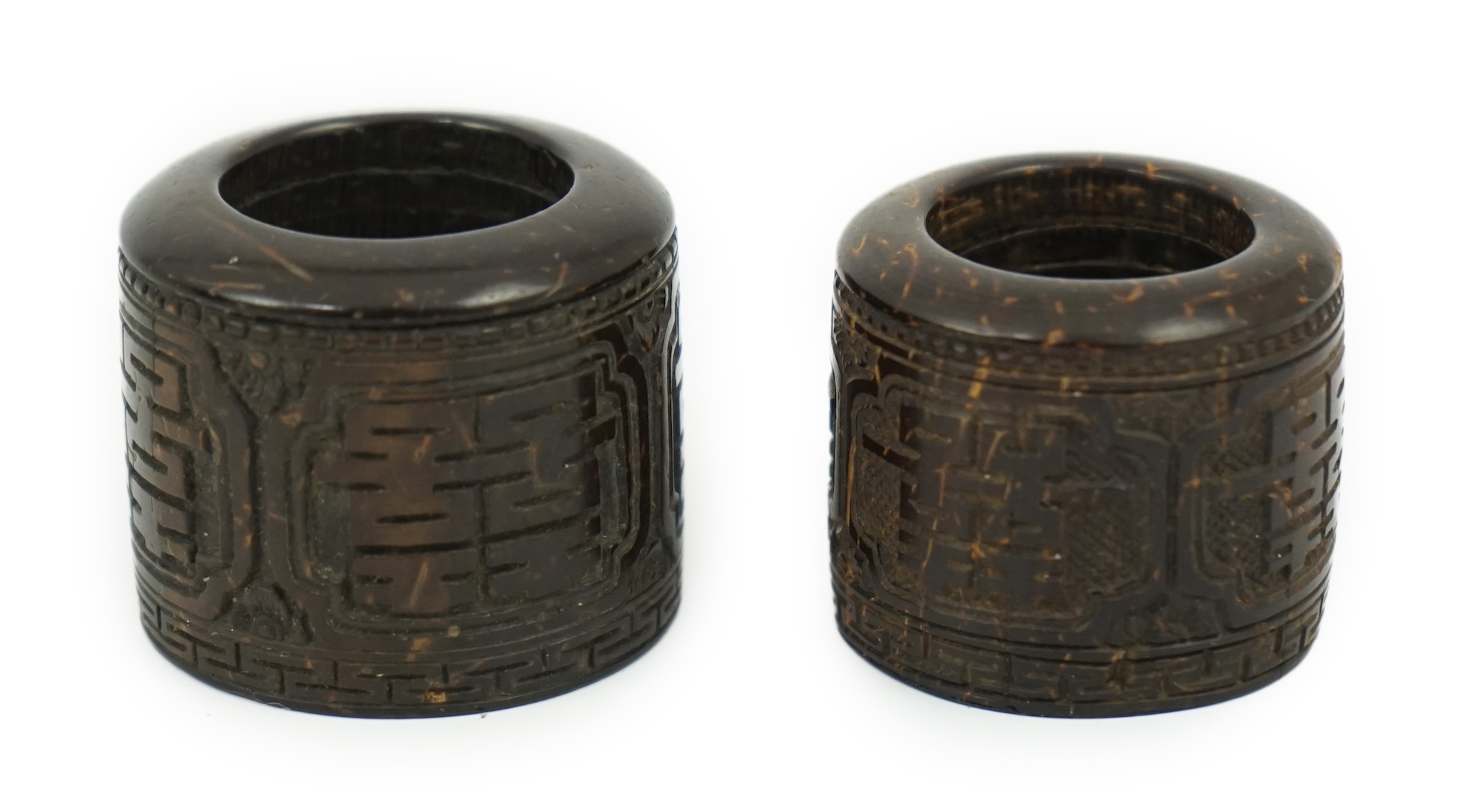 A pair of rare Chinese Straits palm wood archer's thumb rings, 19th century